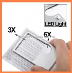 Credit card magnifier with LED light